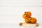 Halloween cute orange handmade felt pumpkins on an old white wooden background with copy space. Halloween kids craft background.