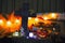 Halloween decorations concept at night. Close up of jack o`lantern, vintage lanterns, pumpkins, skull, autumn leaves