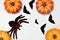 Halloween decorations concept, Scary smiling pumpkin and spider with silhouette of flying black bat