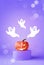 Halloween decorations with pumpkin and ghost on podium on purple background. Halloween party concept.