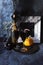 Halloween drinks, wine, pumpkins, mystical decorations on a black background