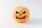 Halloween face on the peeled whole tangerine or mandarine orange fruits.