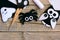 Halloween felt ornaments. Felt ghost, spider, owl ornaments on a vintage wooden table. Sewing craft tools and materials