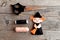 Halloween felt witch with broom, beige and black thread, needle, scissors on old wooden background. Tutorial. Step. Top view