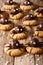 Halloween food: shortbread cookies with chocolate spiders close-up. vertical background