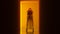 Halloween Ghost With Red Orange Eyes in a Pumpkin Orange Corridor with a Polished Floor Creepy Woman Evil Demon Ghostly Figure