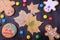 Halloween gingerbread cookies decorated with multicoloured glazing and dry maple leaves