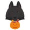 Halloween greeting card. Schipperke dog with several scars over his face and a pumpkin with candies in the mouth