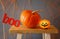 Halloween holiday concept. Cute pumpkin on wooden table