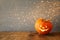 Halloween holiday concept. Cute pumpkin on wooden table