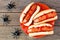 Halloween hot dog fingers over rustic wood