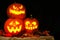 Halloween Jack o Lanterns illuminated at night