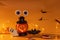 Halloween Lantern candlestick pumpkin with gingerbread cookies in the shape of scary eye bats ghosts