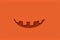 Halloween minimalistic pumpkin color Jack Lantern smile.