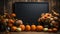 Halloween mockup space with pumpkins, lantern and fallen leaves. Black board with autumn holiday decoration with copy space.