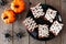 Halloween mummy brownies, above view with decor over wood