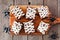 Halloween mummy brownies, top view with spiders on a wood serving board