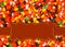 Halloween orange candy corn border with copy space