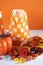 Halloween orange polka dot trick or treat paper bags with multi-color candy - vertical.