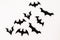 Halloween paper black bats on white background. Flat lay, top view.