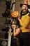 Halloween party concept. Girl and bearded man with shocked faces