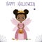 Halloween party. Cute African American girl dressed as a fairy princess with wings and a crown, holding a pumpkin with