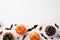 Halloween party decor concept. Top view photo of small pumpkins bat silhouettes creepy insects spiders cockroaches centipedes and