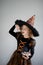 Halloween Party. Girl 8-9 years in image the evil sorcerer.
