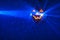 Halloween party pumpkin disco ball, blue shiny rays background