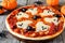 Halloween pizza close up on rustic wood