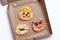 Halloween pizza with monsters, above scene with decor on a craft paper box background, idea for home party food, easy, healthy