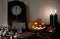 Halloween. playing cards, queen of spades, candles, pumpkins and the old clock on the wooden background