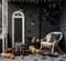 a halloween porch with pumpkins and chairs