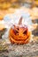 Halloween Preparaton Concept. Carved pumpkin on ground close-up