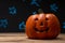 Halloween pumpkin on a background of blue blurry stars, lights. With space for design, festive mood