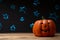 Halloween pumpkin on a background of blue blurry stars, lights. With space for design, festive mood