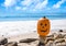 Halloween pumpkin on the beach