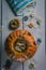 Halloween pumpkin and candies on a white table