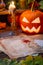 Halloween pumpkin and candle on witch\'s table