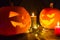 Halloween pumpkin. Candles, bat and glowing pumpkin. Harvest for Halloween. Dark atmosphere for holiday