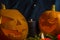 Halloween pumpkin. Candles, bat and glowing pumpkin. Harvest for Halloween. Dark atmosphere for holiday