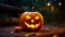 Halloween pumpkin. Carved Halloween pumpkin glowing in the dark. Outdoor shot