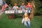 Halloween Pumpkin Characters Sitting on Wagon and Lawn, New England