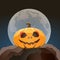 Halloween pumpkin closeup in moon light on a rock
