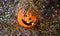 Halloween pumpkin covered with streamers