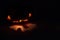 Halloween pumpkin creepy face lightning in darkness. Pumpkin face glowing silhouette photo.