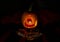 Halloween Pumpkin in dark atmosphere. Horror Cult icon. Scary face