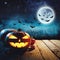 Halloween Pumpkin in a dark mist Forest. Elements of this image furnished by NASA