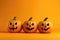 Halloween Pumpkin Decorations Arranged On Yelloworange Background, Adding Festive Touch