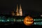 Halloween pumpkin in front of Cathedral and Danube river in germany, Germany